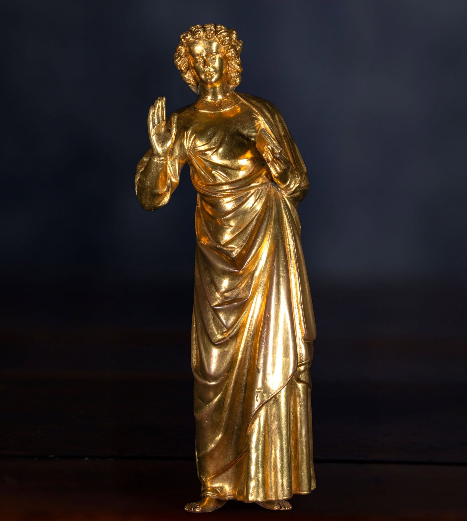 Gilt Copper sculpture of Saint John the Evangelist, Tresor of Rouen Cathedral, France, 18th century,: Gilt copper, repoussé and engraved. Dimensions: 21.5 x 7.7 cm. This small appliqué statue of Saint John the Evangelist was originally part of the Gothic reliquary shrine of the Church of