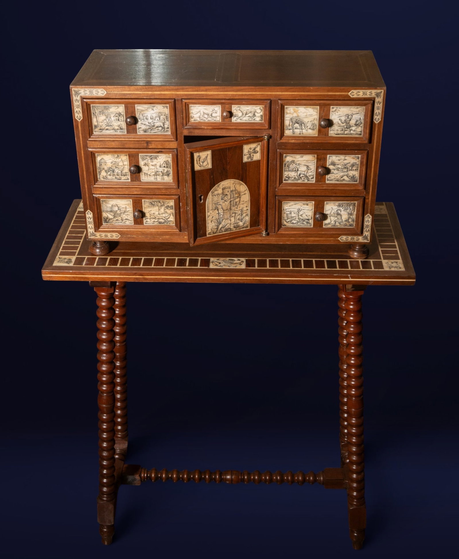 Bargueño with hunting scenes, Renaissance style, 19th century: Wooden bargueño with bone inlays and hunting motifs. Measures 107 x 65 x 28 cm with table.