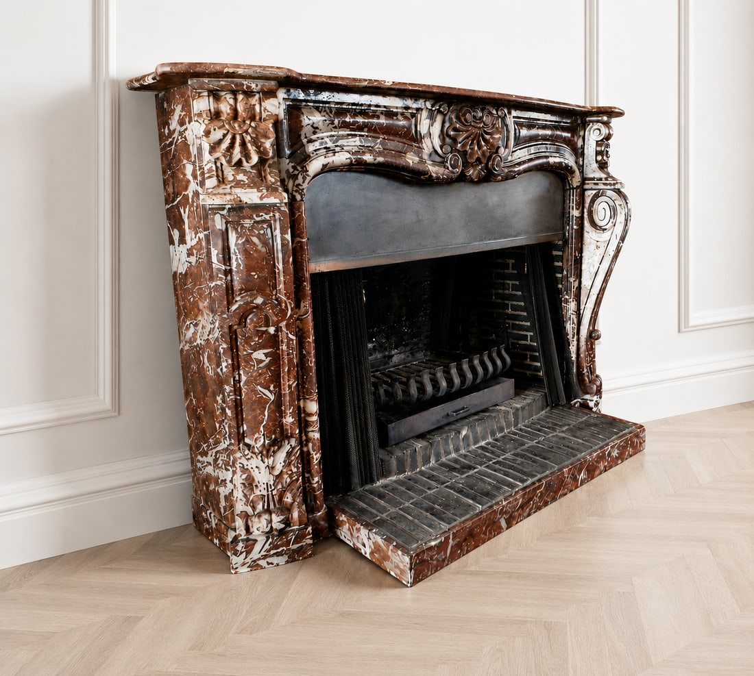 LOUIS XV STYLE FIREPLACE. FRANCE, 20TH CENTURY: Monumental fireplace in Rouge Royal marble. Carved Rouge Royal marble. Dimensions: width 168 cm; mantel depth 33.5 cm; height 116 cm; interior clearance 108 cm. Magnificent Louis XV style fireplace cr