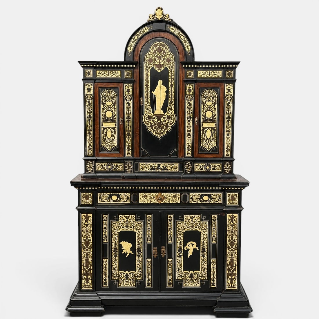 Two-section cabinet with bone marquetry, attributed to Ferdinando Pogliani. Italian school. 19th: Ebonized and veneered wood with rich inlays of carved and engraved bone. Measures 205 x 118 x 45 cm. An exceptional two-part cabinet conceived following the monumental models of Italian historicism, a