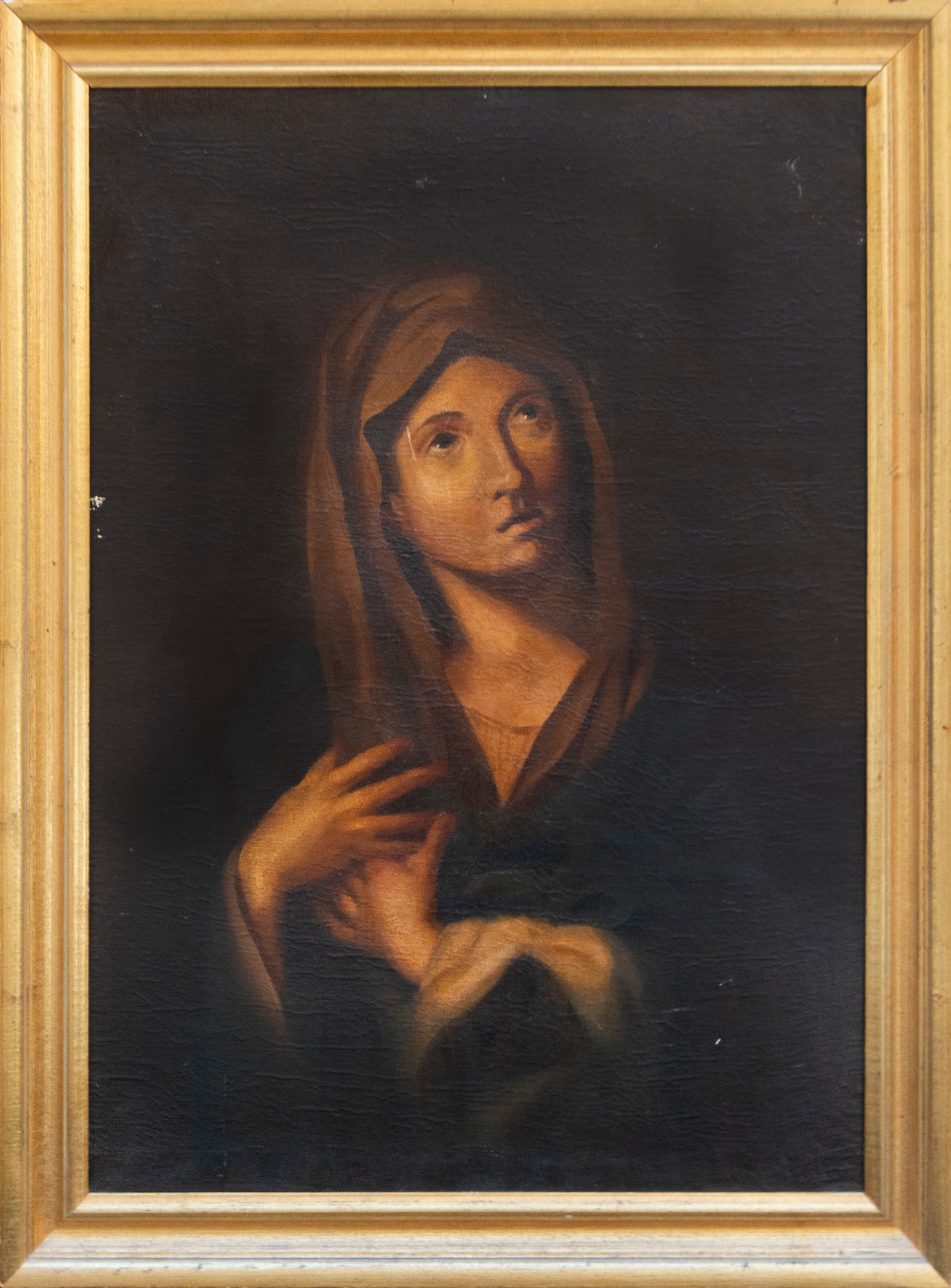 Praying Virgin, Spanish School, 18th-19th Century: Oil on canvas. Dimensions: 91 x 64 cm; framed 105 x 78 cm. Devotional image of the Virgin Mary, half-length, with a dark veil, her face raised, and hands crossed over her chest in an attitude of praye