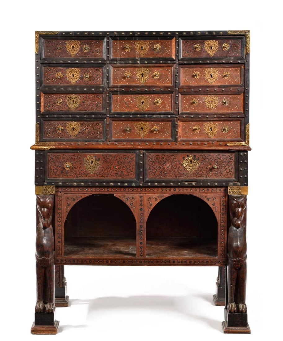 Indo-Portuguese Cabinet with Marquetry Decoration and Zoomorphic Supports, Portuguese India, 17th: Teak wood with ebony and bone marquetry, metal fittings and carving. Measurements: 123 x 88 x 46 cm. Indo-Portuguese cabinet of architectural construction, composed of an upper section with numerous d