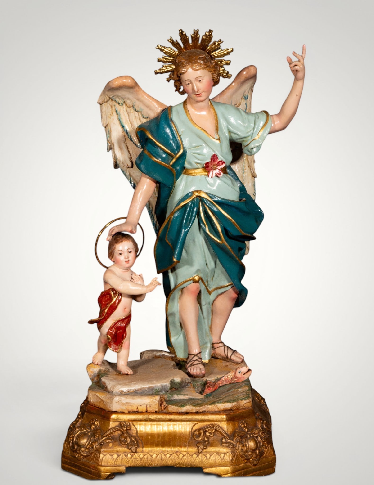 Saint Raphael the Archangel, attributed to Francesco Ingaldi, Neapolitan School, 18th Century: Carved and polychromed wood. Dimensions: 57 x 27 cm. Saint Raphael the Archangel appears accompanied by the young Tobias, whom he guides with a protective gesture, pointing the way with his raised han
