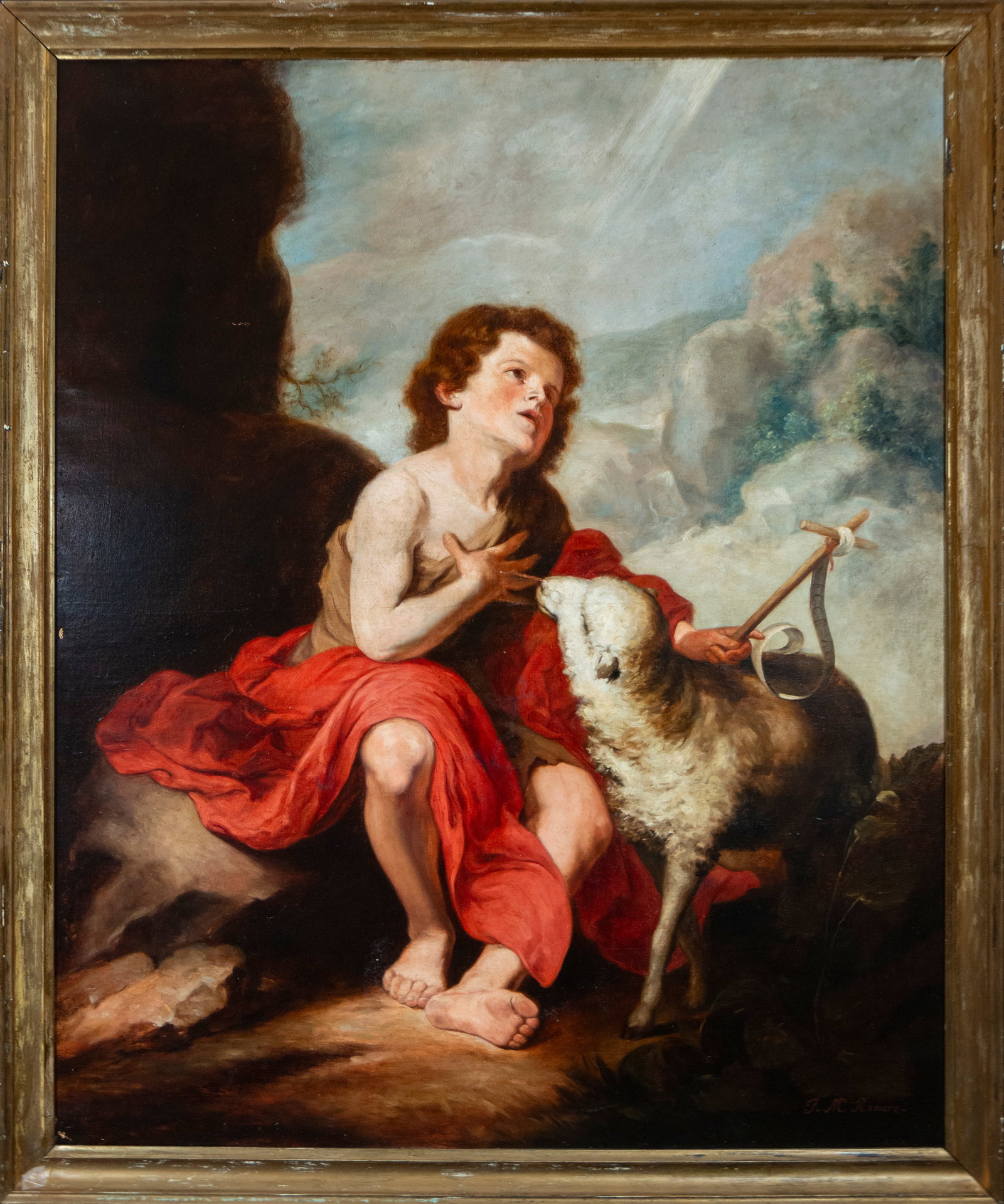 Saint John the Baptist as a child with the lamb. Signed. Spanish School. 19th century: Oil on canvas. Dimensions without frame: 111 x 91 cm. Dimensions with frame: 120 x 100 cm. The infant Saint John the Baptist is depicted seated on a rocky landscape, partially covered by a fur and a w