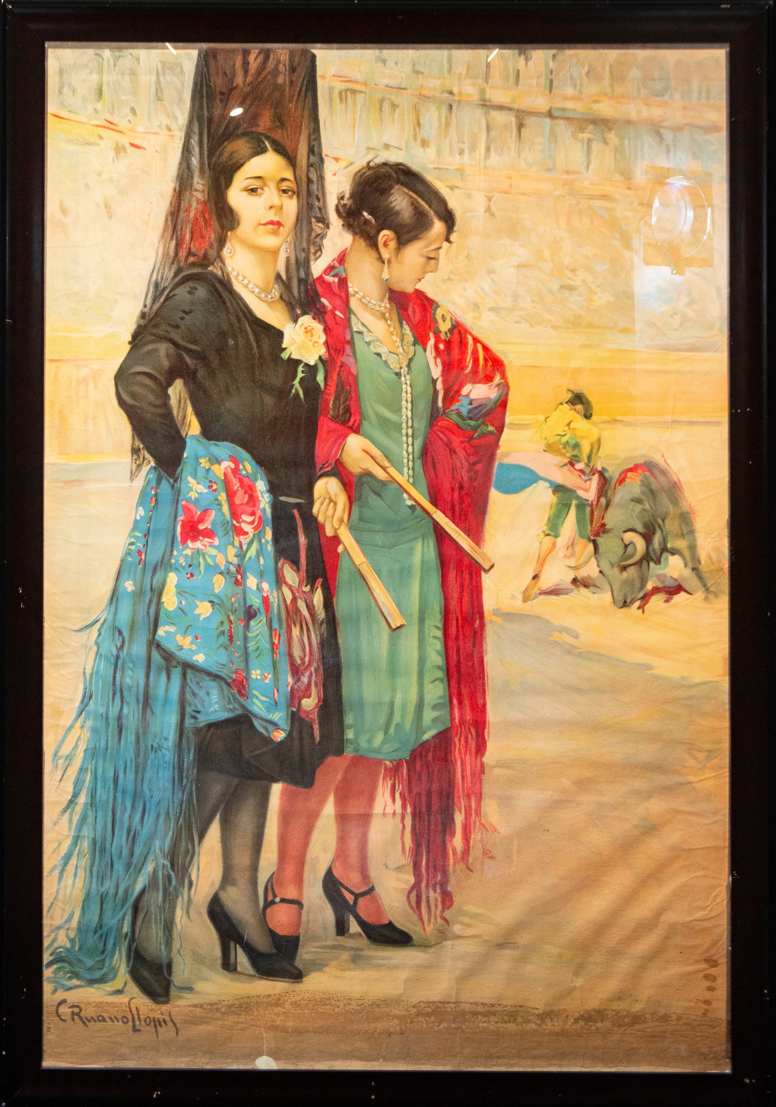 Two Majas, Signed C. Ruano Llopis, Spanish School, 20th Century: Pastel on paper. Dimensions without frame: 160 x 108 cm. Dimensions with frame: 172 x 120 cm. Two elegant women adorned with shawls and hair combs next to a bullring, an example of the refined Valenci