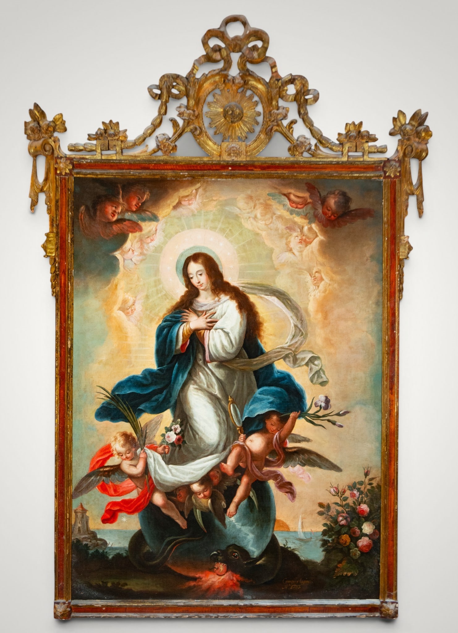 Great Immaculate Conception. Signed and dated 1797. Colonial School of New Spain. 18th Century: Oil on canvas. Dimensions without frame: 133 x 98 cm. Dimensions with frame: 184 x 130 cm. The Immaculate Conception rises above the sphere and the dragon, accompanied by angels with flowers, a palm, 