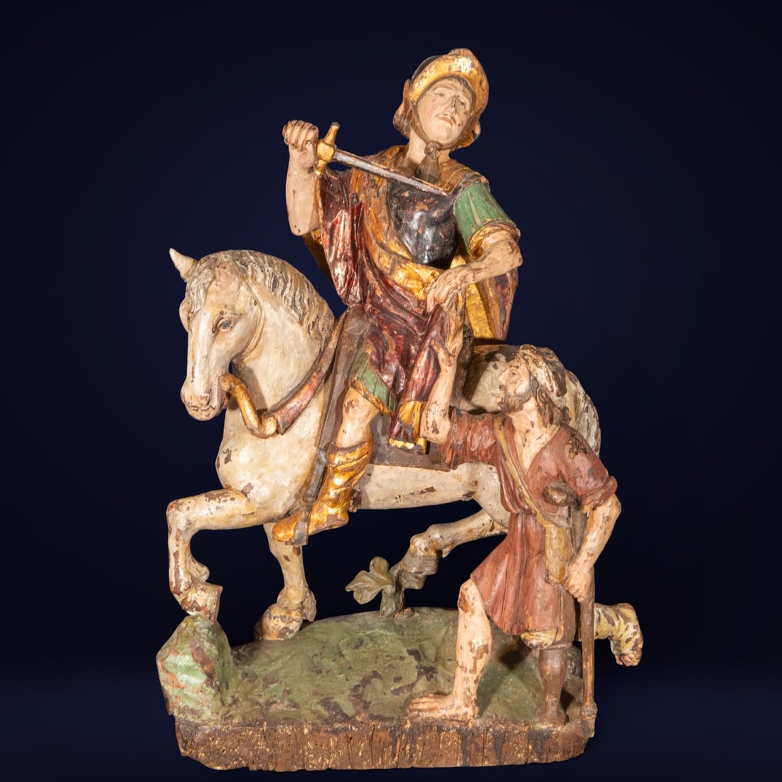 Saint Martin on horseback, German or Central European school of the 17th century: Carved and polychromed wood. Measures 68 x 42 x 21 cm.
