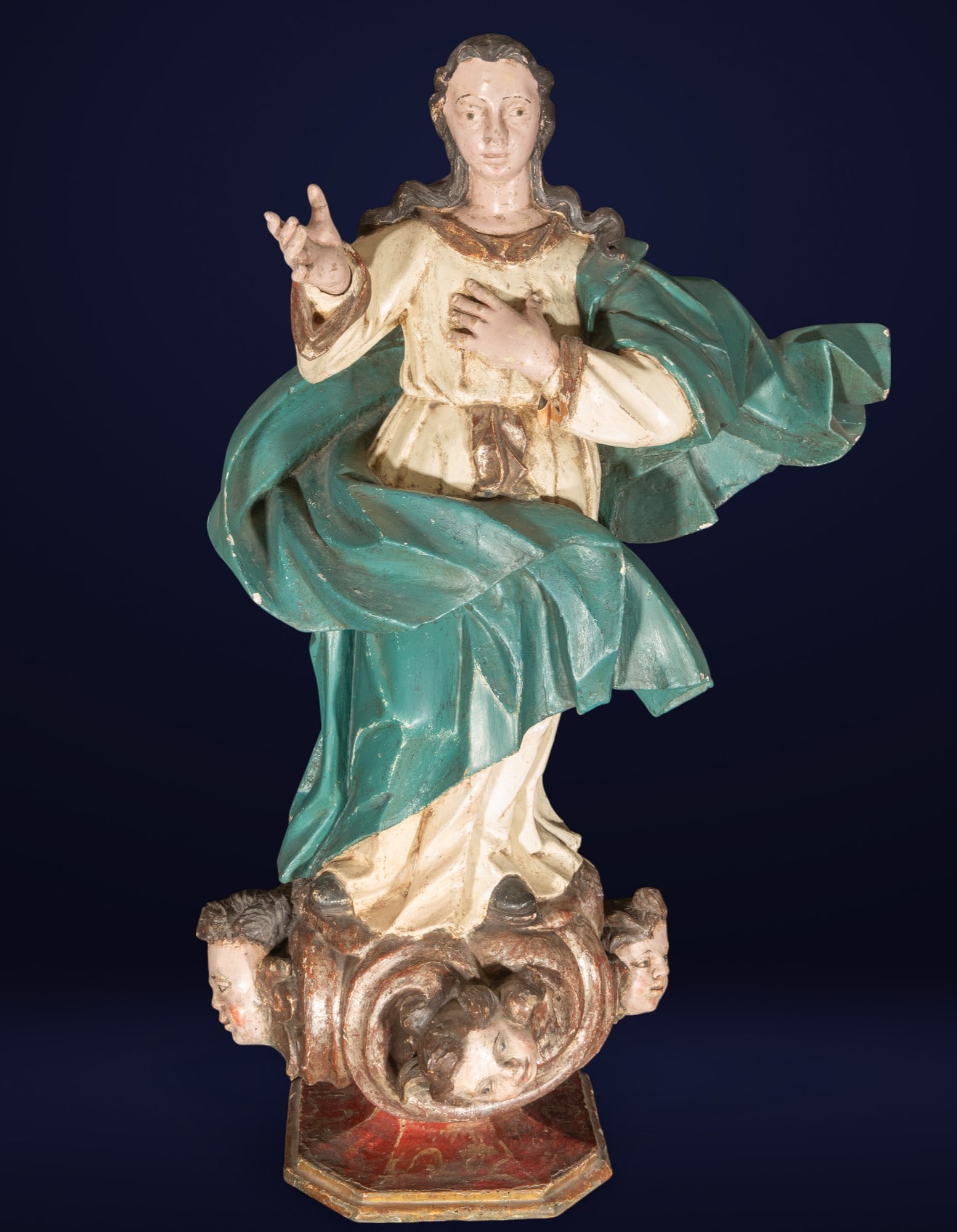 Immaculate Virgin, Goa - India - 18th Century: Carved, upholstered, and polychrome wood. Full-length sculpture of the Pure Virgin, rendered in the round, with an oval face with serene features, almond-shaped eyes, and half-open lips that accentuat