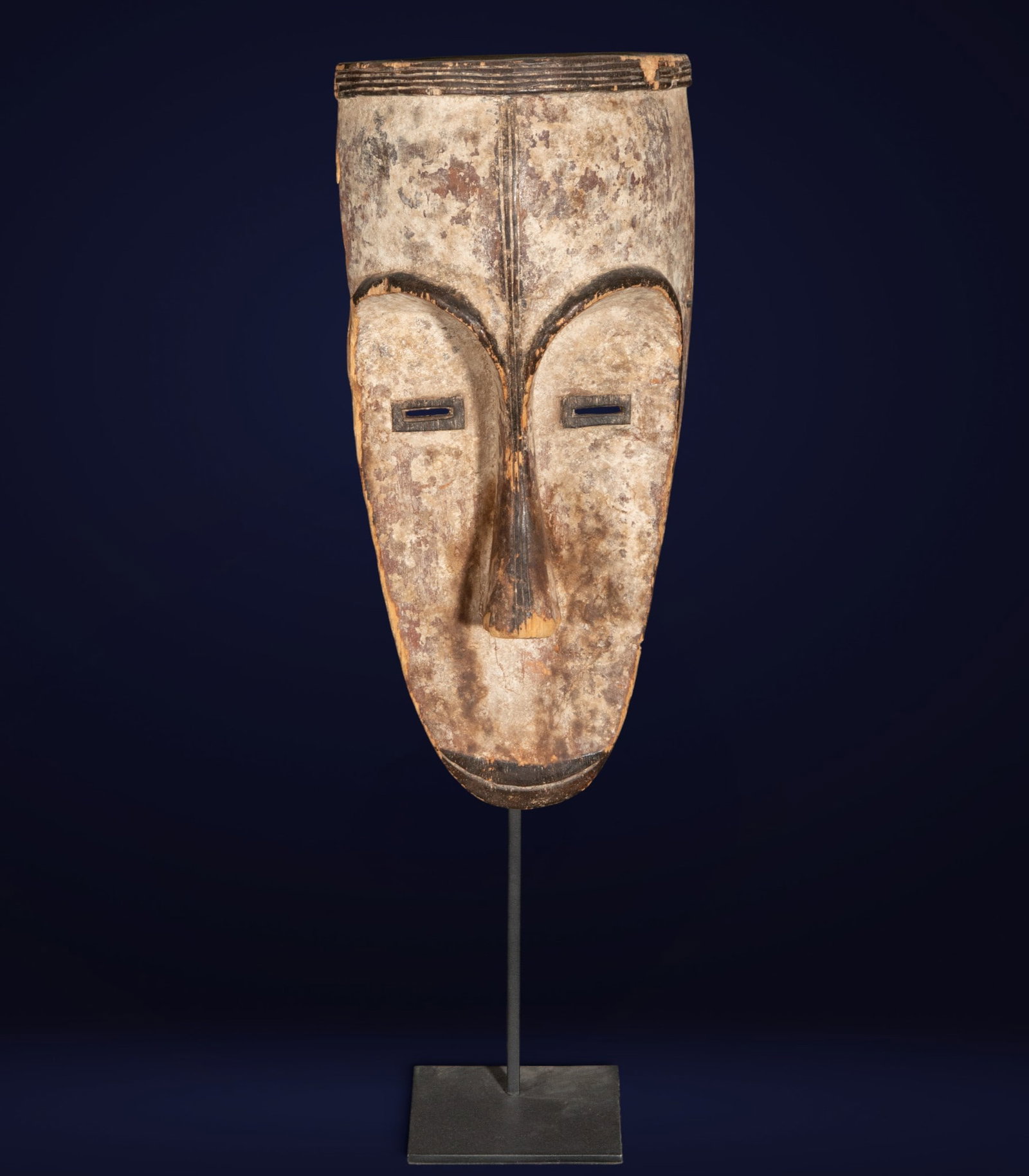 Fang Mask Gabon 20th Century: Carved and polychromed wood. Measures 36 x 16 x 10 cm.