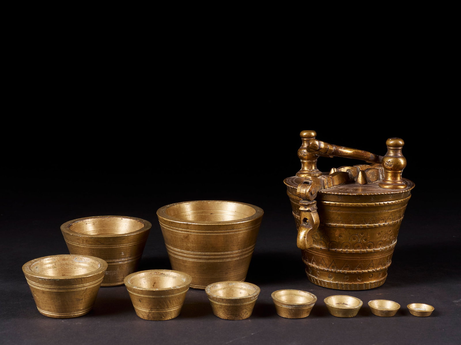 Copper alloy weights. West Africa, 20th century: Copper alloy. Dimensions: 9.8 × 9.4 cm. Set of traditional weights cast in copper alloy, used as measuring instruments in pre-modern West African trade systems. These weights were part of complex exc