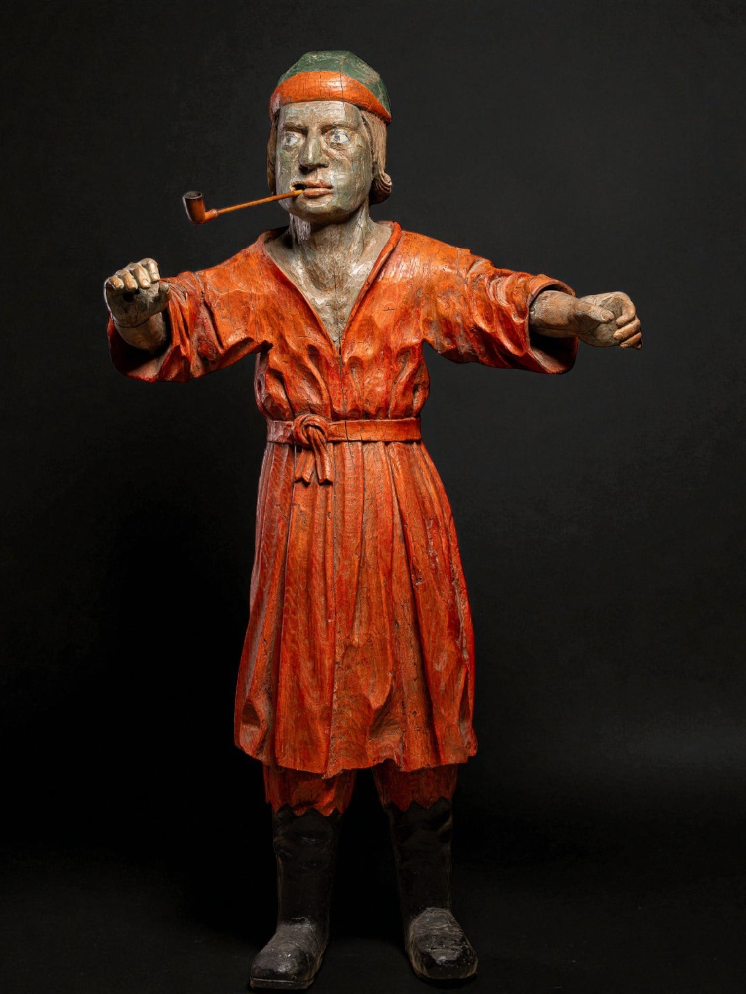 Advertising sculpture for a tobacconist's shop with a figure smoking a pipe, France, 19th century: Carved and polychromed wood. Dimensions: 124 × 70 × 34 cm. Magnificent polychromed wooden sculpture used as an advertising figure for a tobacco shop in the 19th century. It depicts a man smoking a p