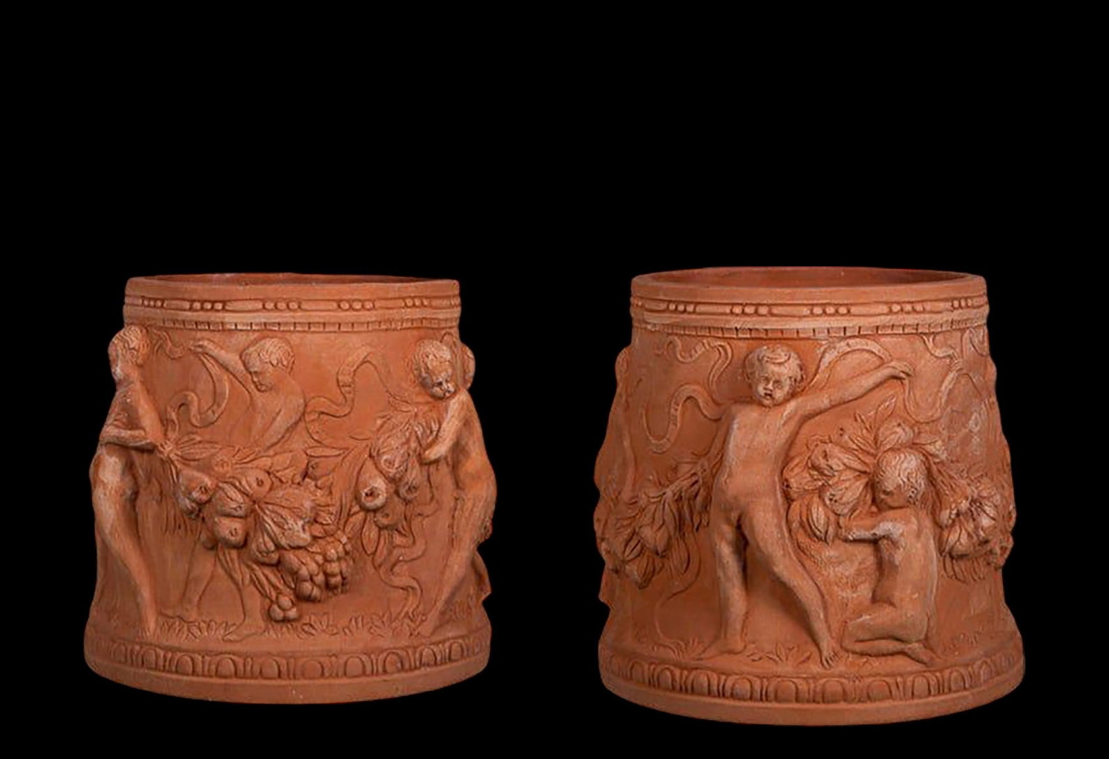 Rare pair of cylindrical vases with putti in Impruneta terracotta, late 20th century: Inner diameter (cm) 22 Height (cm) 30 Base dimensions (cm) 32. Weight (kg) 9.