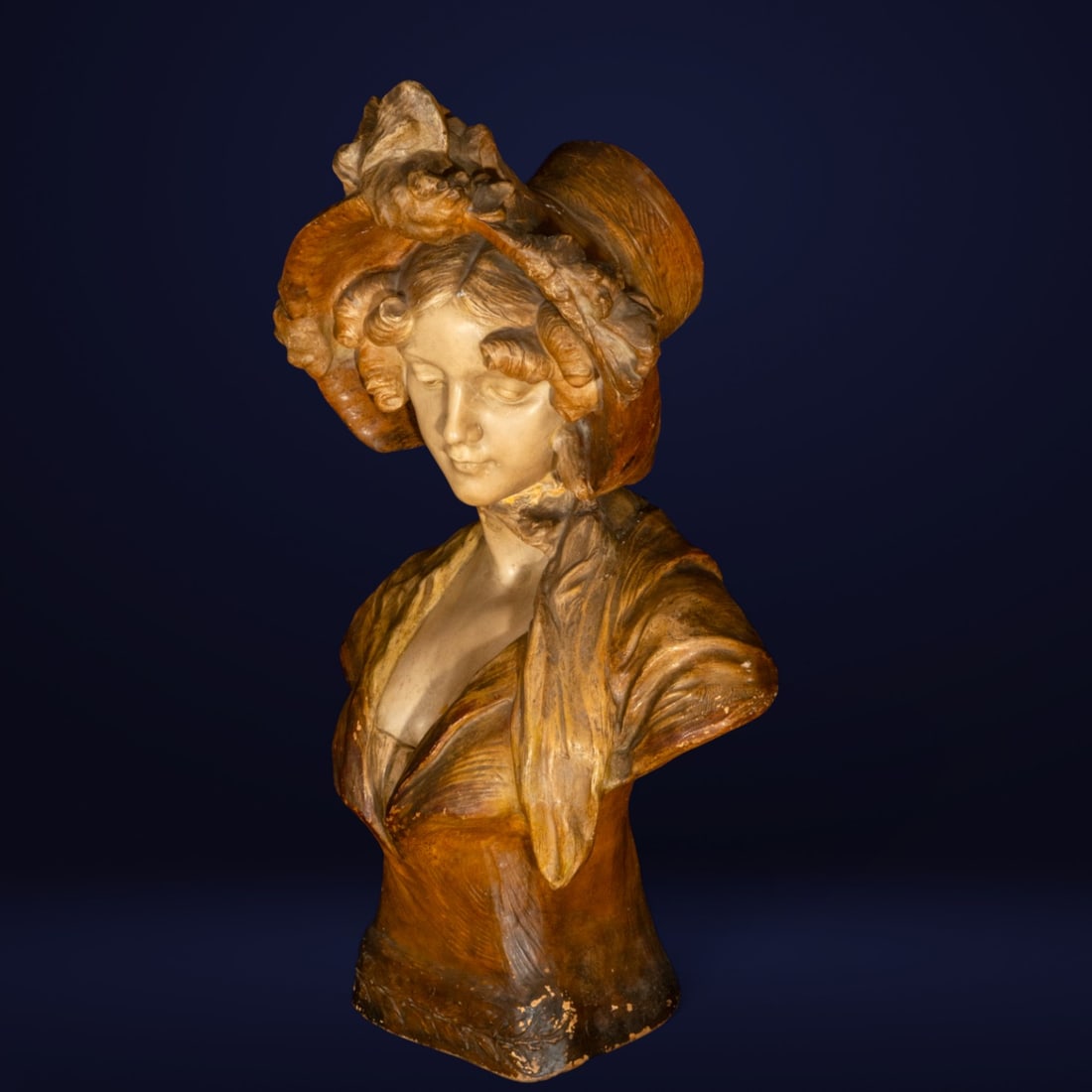 Terracotta sculpture, bust of a young lady with a hat, early 20th century: Measurements: 72 cm x 42 cm x 32 cm