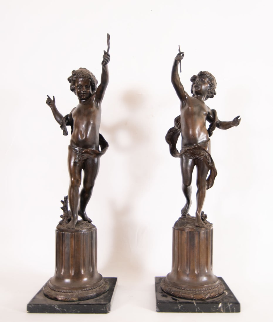 Pair of Important Cupids in Patinated Bronze, French School of the 19th Century: With marble bases, cupids measurements: 73 x 29 x 23 cm. Measurements with base: 76 x 29 x 24 cm