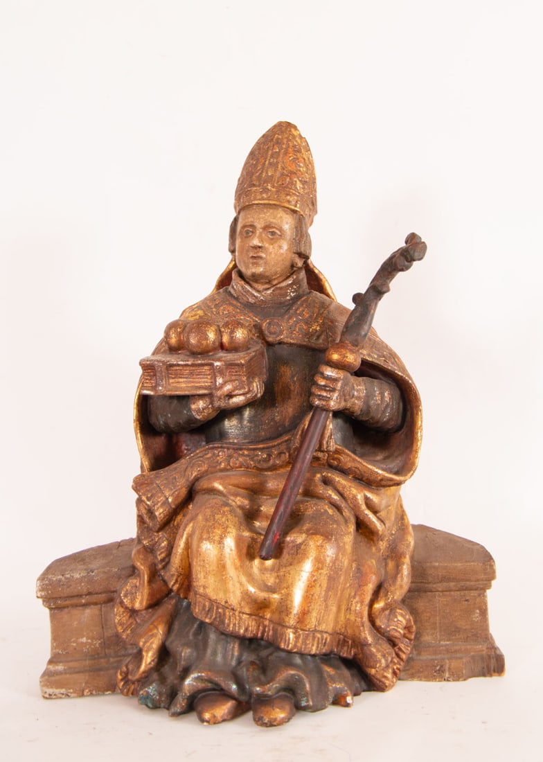 Carving of a Bishop, Sevillian school of the 18th century: In carved, gilt and polychrome wood, measurements: 60 x 50 x 21 cm