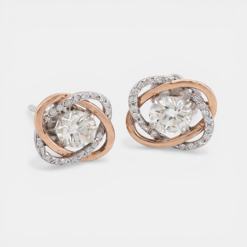 Earrings with diamonds of approx. 1 ct in the center and a halo of diamonds totaling 0.25 ct. (1 of 1)