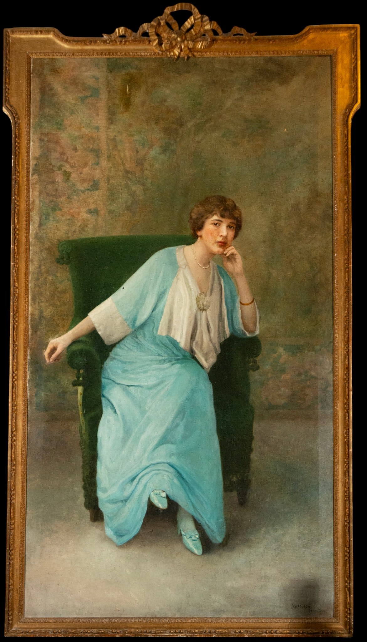 Large Portrait of a Noucentista Lady - Painter NAPOLEON, signed in Barcelona: Oil on canvas. Dimensions 200 x 110 cm and 219 x 129 cm. Full-length portrait of a young woman seated in a dark armchair, with her head slightly inclined and one hand resting on her face, dressed in a