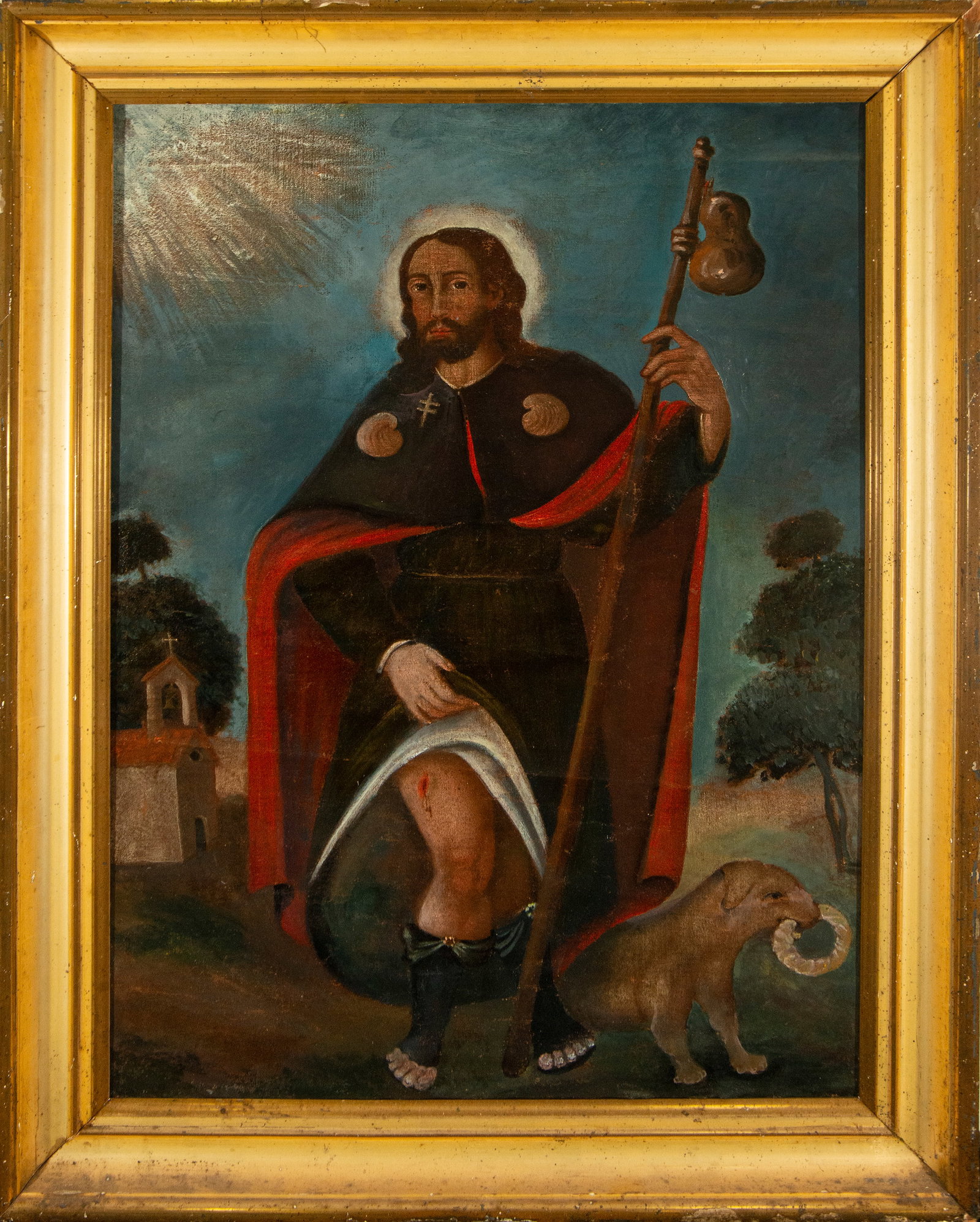 Saint Roch with dog. Colonial School. 18th Century.: Oil on canvas. Measures 86 x 60 cm (100 x 76 cm with frame). The holy pilgrim appears standing, with a staff, wearing a cape and cloak in dark tones with a red lining, displaying the wound on his thig