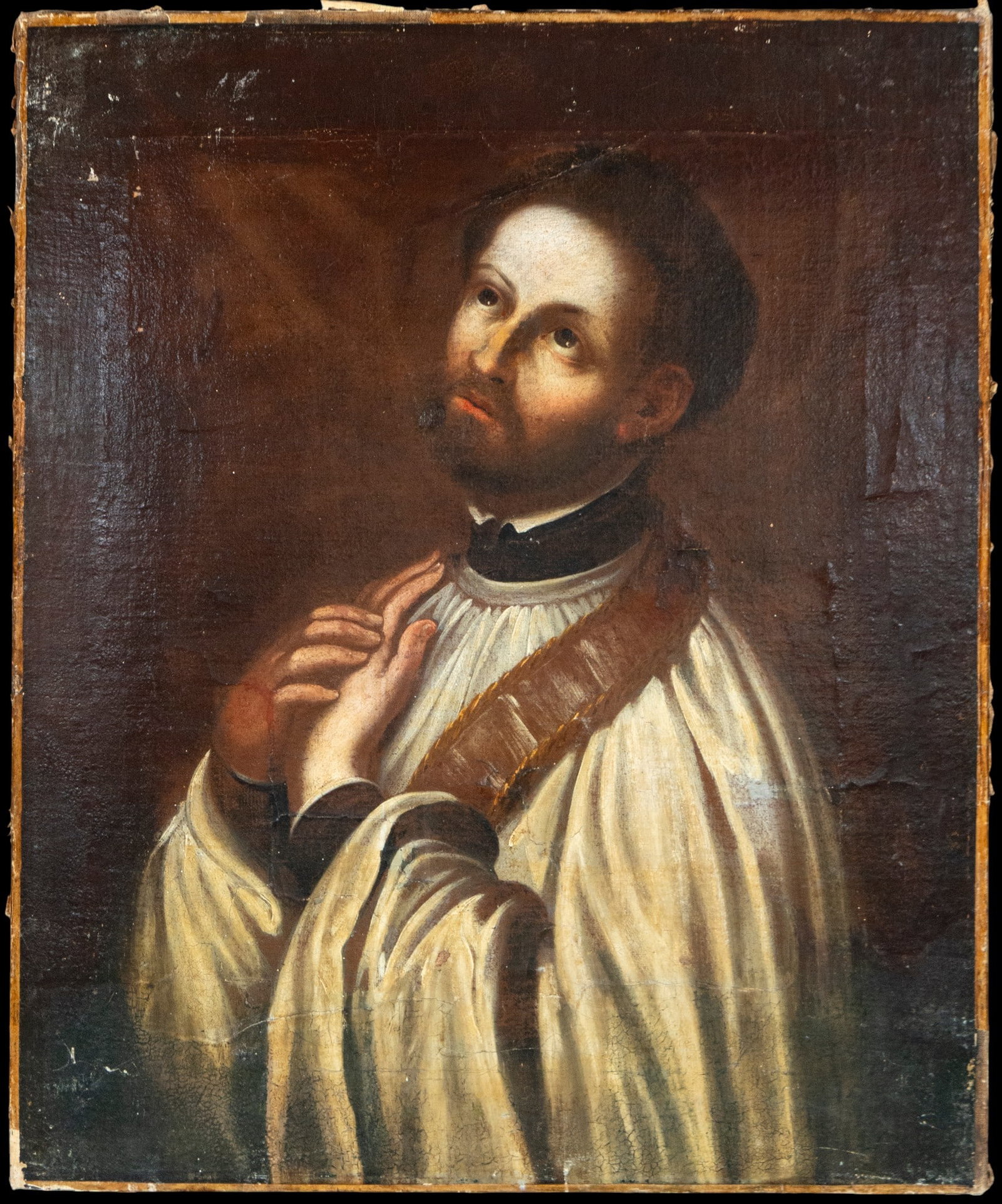 Saint Ignatius of Loyola, New Spain - Colonial School - 17th Century: Oil on canvas. Dimensions 77 x 64 cm. Devotional portrait of Saint Ignatius of Loyola in a contemplative pose, with his gaze raised and an expression of spiritual recollection. The lighting focuses at