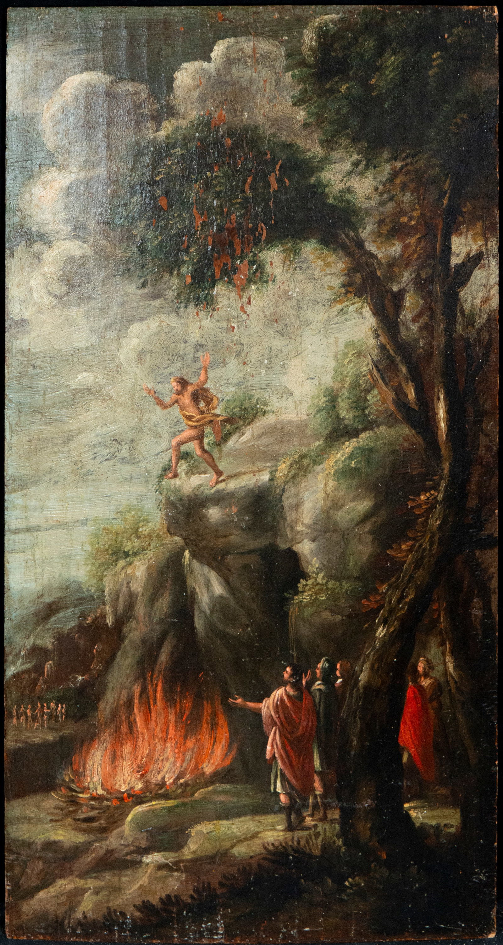 The fire at San Antonio, Italian School, 17th Century: Oil on panel. Dimensions 65 x 36 cm. A religious scene unfolds against a vast, rocky, and mountainous landscape, structured around a narrative episode accompanied by various figures arranged on differ