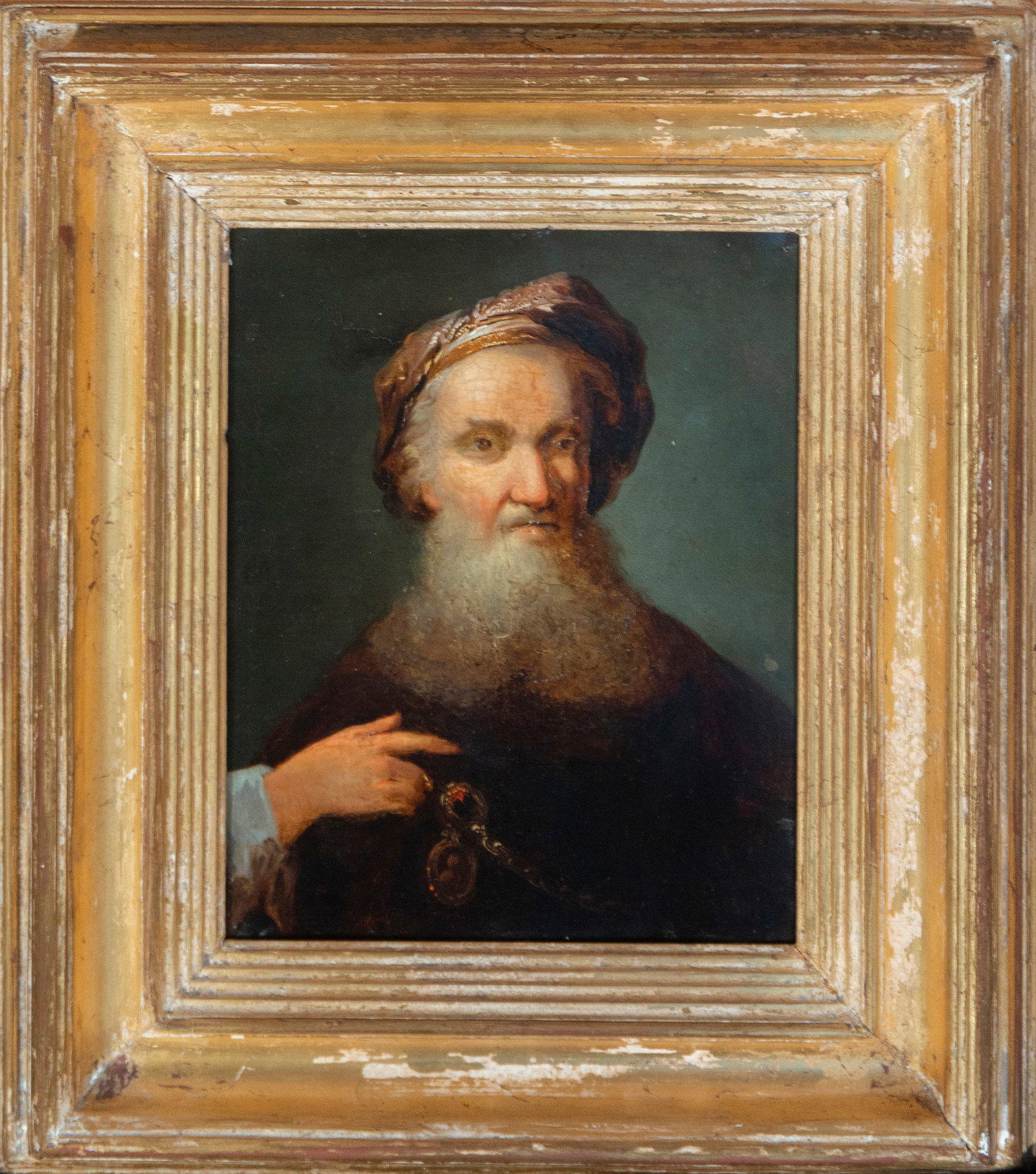 Old man with turban. Follower of Rembrandt. Flemish School. 17th century: Oil on metal. Dimensions: 27.4 x 22.3 cm (45 x 40 x 6 cm with frame). A male portrait in intense chiaroscuro, depicting an elderly man, wearing a turban, emerging from the shadows. The work displays a