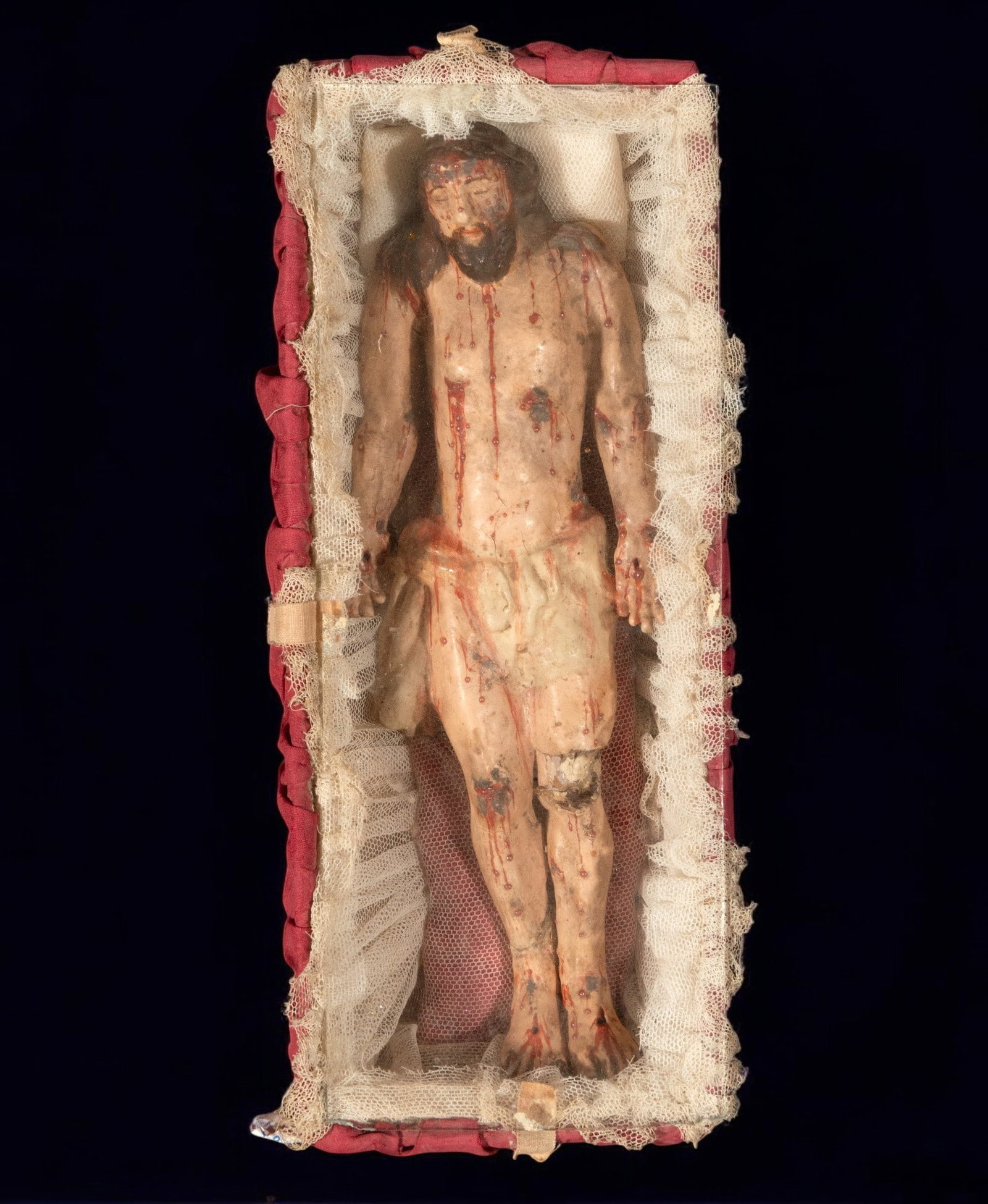 Recumbent Christ in terracotta, possibly Portuguese colonial: Terracotta. Measurements: 26 cm x 10 cm x 8 cm