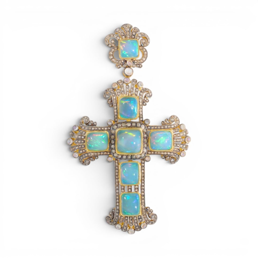 Pendant cross in silver gilt with opals, moonstones and rose cut diamonds: Partially gilded 925 sterling silver with a 14-karat gold bail, opals, moonstones, and rose-cut diamonds. This magnificent pendant cross is crafted from partially gilded sterling silver and adorned wi