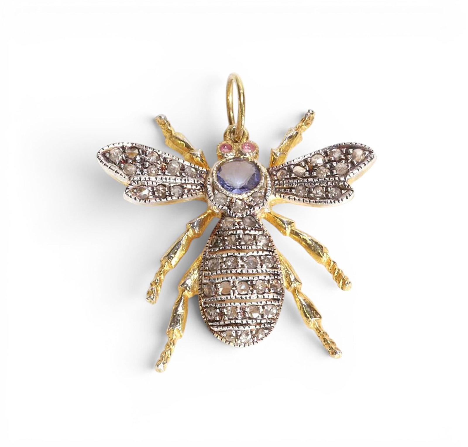 Bee-shaped pendant in silver gilt with rose-cut diamonds, tanzanite and spinels: Partially gilded 925 sterling silver with a 14-karat gold bail, rose-cut diamonds, tanzanite, and red spinels. This unique bee-shaped pendant is crafted from partially gilded sterling silver and adorn