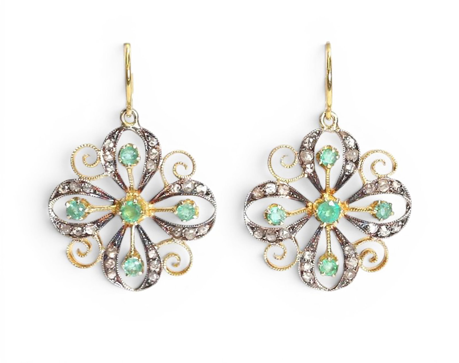 Pair of floral earrings in silver gilt with rose cut diamonds and emeralds: Partially gilded 925 sterling silver, rose-cut diamonds, and emeralds. Elegant pair of openwork floral earrings, adorned with 48 rose-cut diamonds weighing approximately 0.40 ct and 10 emeralds weighi