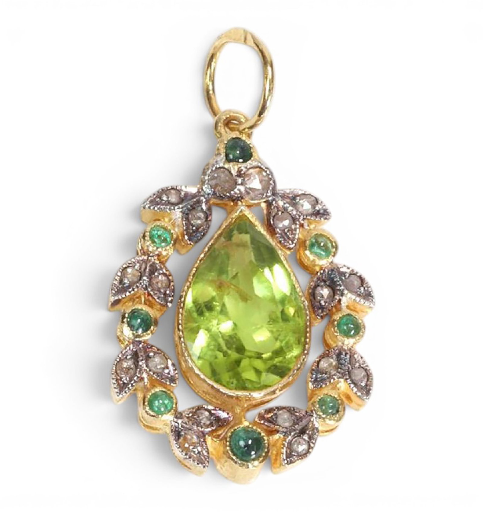 Pendant in silver gilt with peridot, emeralds and rose cut diamonds: Partially gilded 925 sterling silver with a 14-karat gold bail, peridot, emeralds, and rose-cut diamonds. This elegant pendant features a pear-shaped peridot of approximately 1.50 ct, surrounded by ei