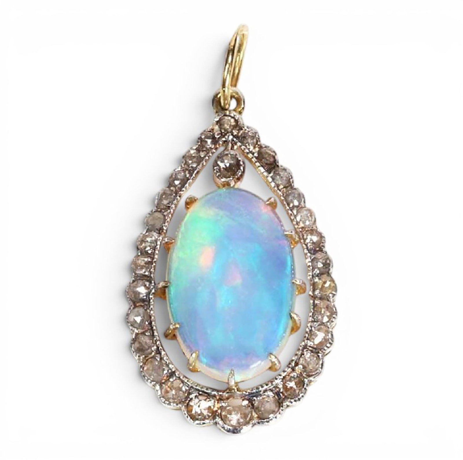 Pendant in silver gilt with opal and rose cut diamonds: Partially gilded 925 sterling silver with a 14-karat gold bail, opal, and rose-cut diamonds. This elegant pendant features a central oval opal of approximately 2.70 ct, surrounded by 28 rose-cut diamo