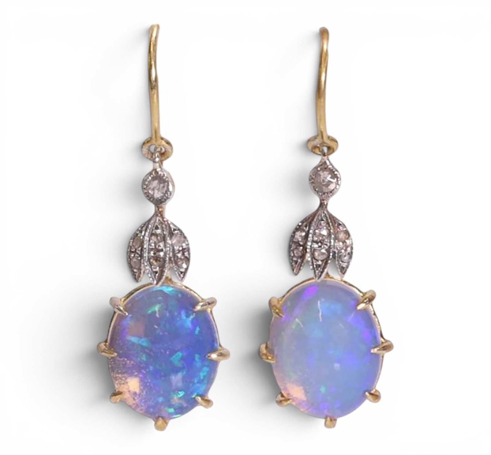 Pair of earrings in silver gilt with opals and rose cut diamonds: Partially gilded 925 sterling silver, opals, and rose-cut diamonds. A delicate pair of earrings crafted in partially gilded sterling silver, adorned with two opals weighing approximately 2.50 ct and e