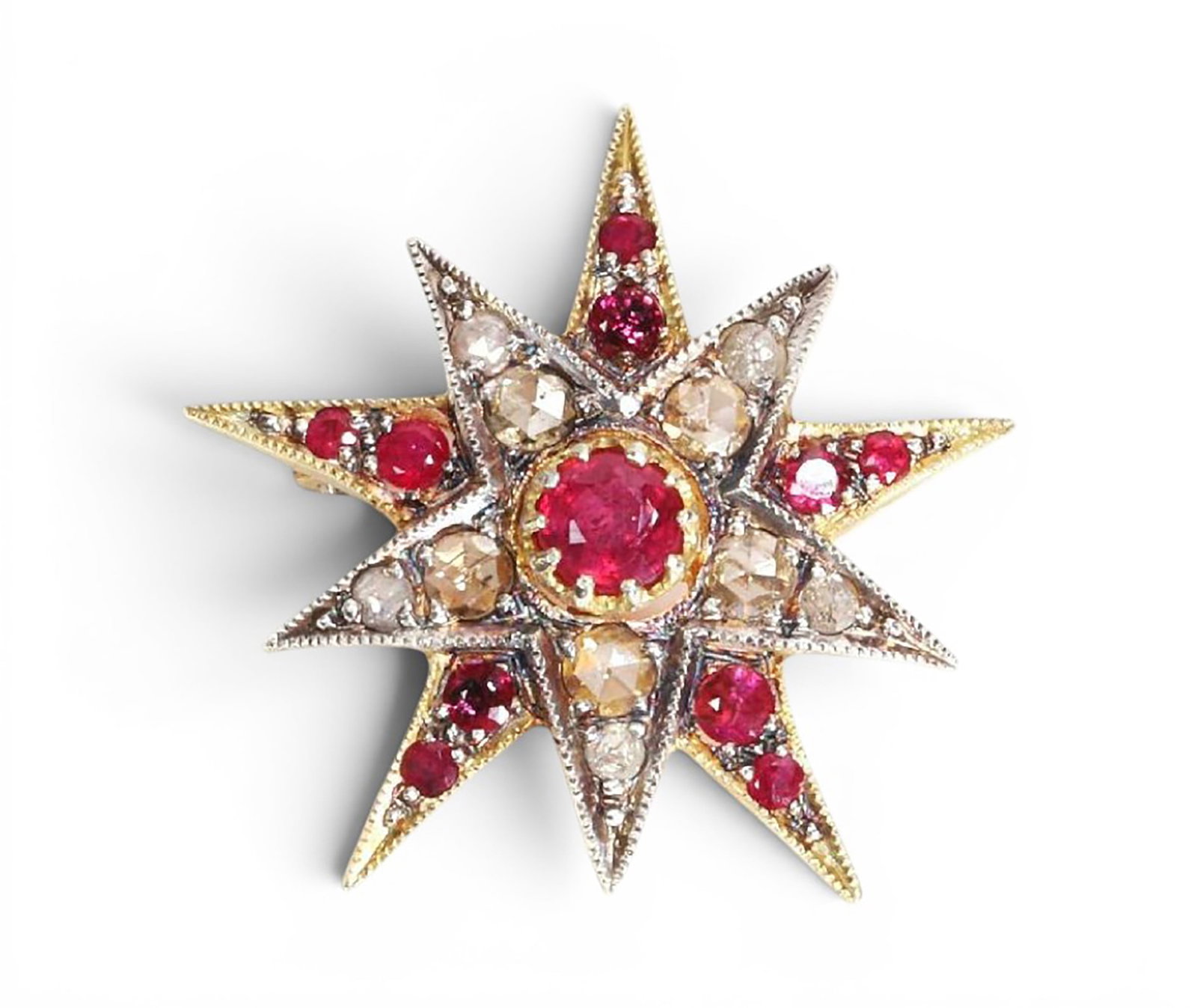 Star-shaped pendant in silver gilt with rubies and rose-cut diamonds: Partially gilded 925 sterling silver with a 14-karat gold bail, rubies, and rose-cut diamonds. This unique star-shaped pendant is crafted from partially gilded sterling silver and adorned with 10 rubi