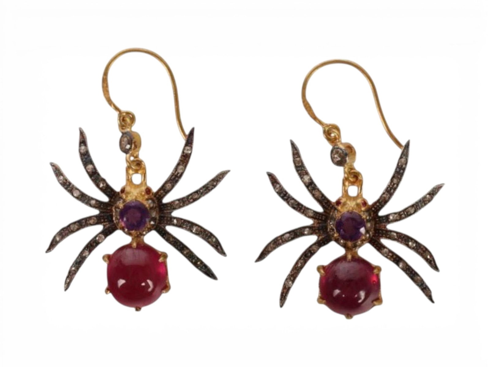 Pair of spider-shaped earrings in silver gilt with rubies, amethysts, spinels and rose-cut diamonds: Partially gilded 925 sterling silver, treated natural rubies, amethysts, spinels, and rose-cut diamonds. An original pair of spider-shaped earrings crafted in partially gilded sterling silver, adorned