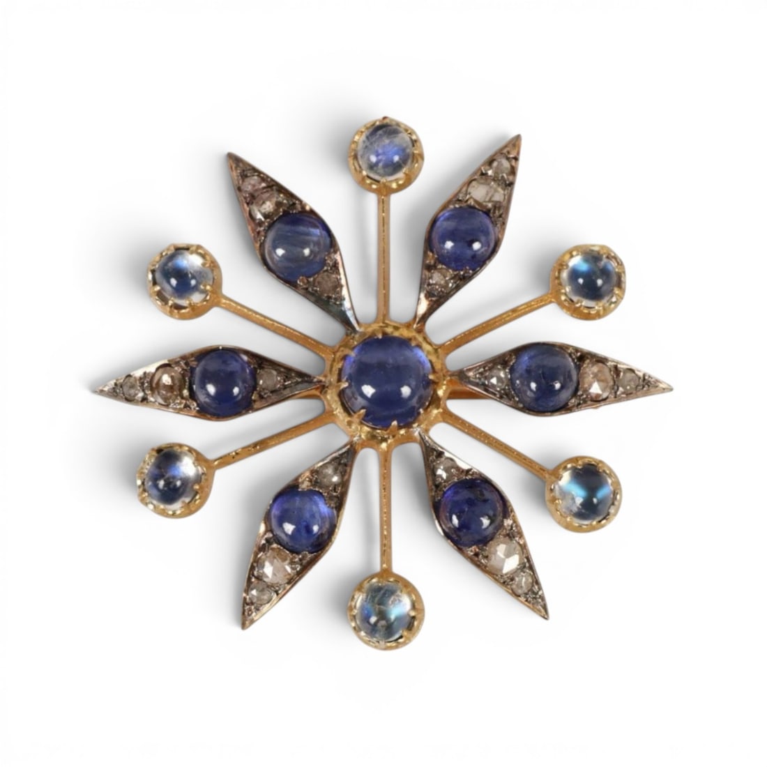 Star-shaped pendant in silver gilt with sapphires, rainbow moonstones and rose-cut diamonds: Partially gilded 925 sterling silver with a 14-karat gold bail, treated natural sapphires, rainbow moonstones, and rose-cut diamonds. This original star-shaped pendant is crafted from partially gilded