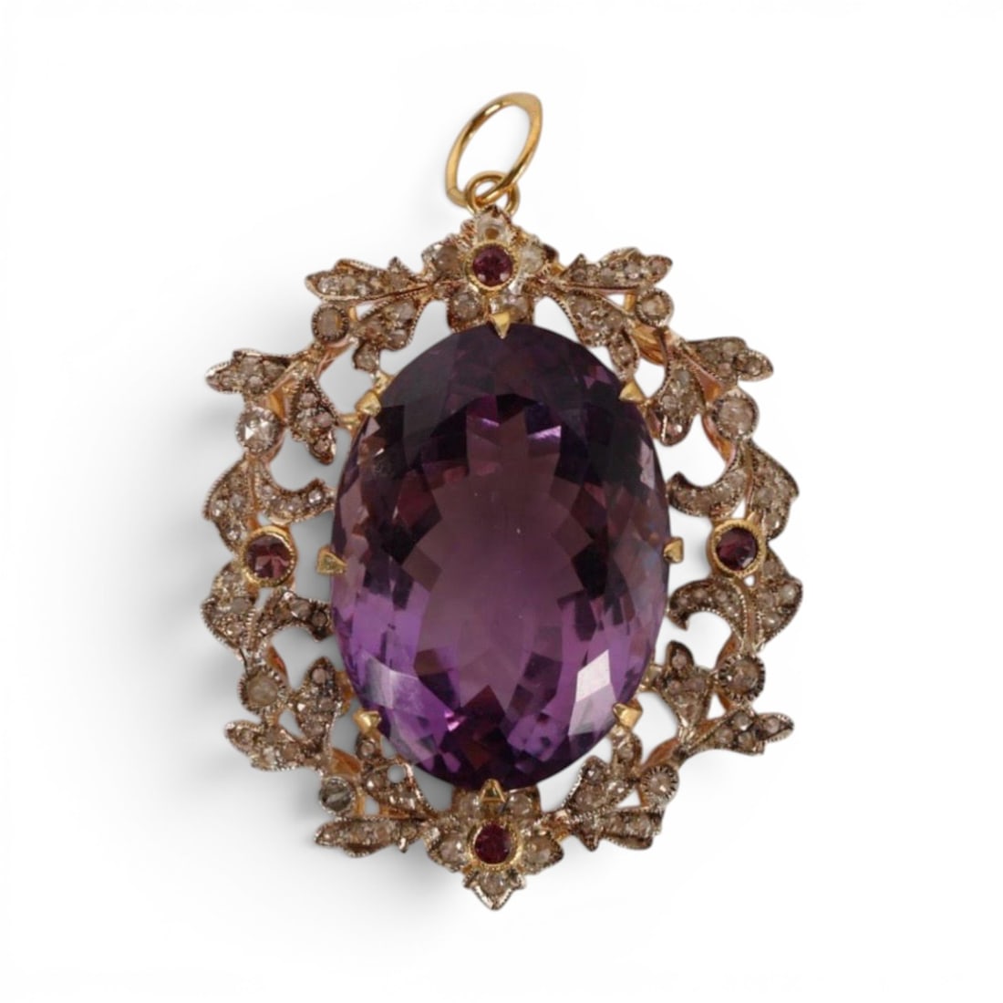 Silver-gilt pendant with amethyst and rose-cut diamonds: Partially gilded 925 sterling silver with a 14-karat gold bail, amethyst, and rose-cut diamonds. This spectacular pendant features an oval amethyst of approximately 35 carats, surrounded by rose-cut d