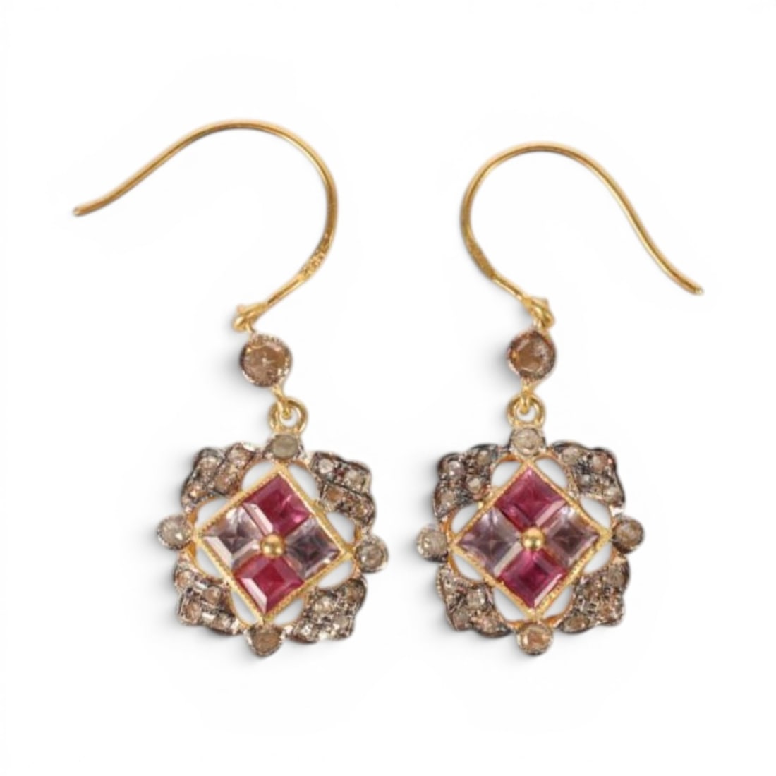 Pair of earrings in silver gilt with rubies, amethysts and rose cut diamonds: Partially gilded 925 sterling silver, rubies, amethysts, and rose-cut diamonds. Elegant pair of earrings crafted in partially gilded sterling silver, adorned with 40 rose-cut diamonds weighing approxi