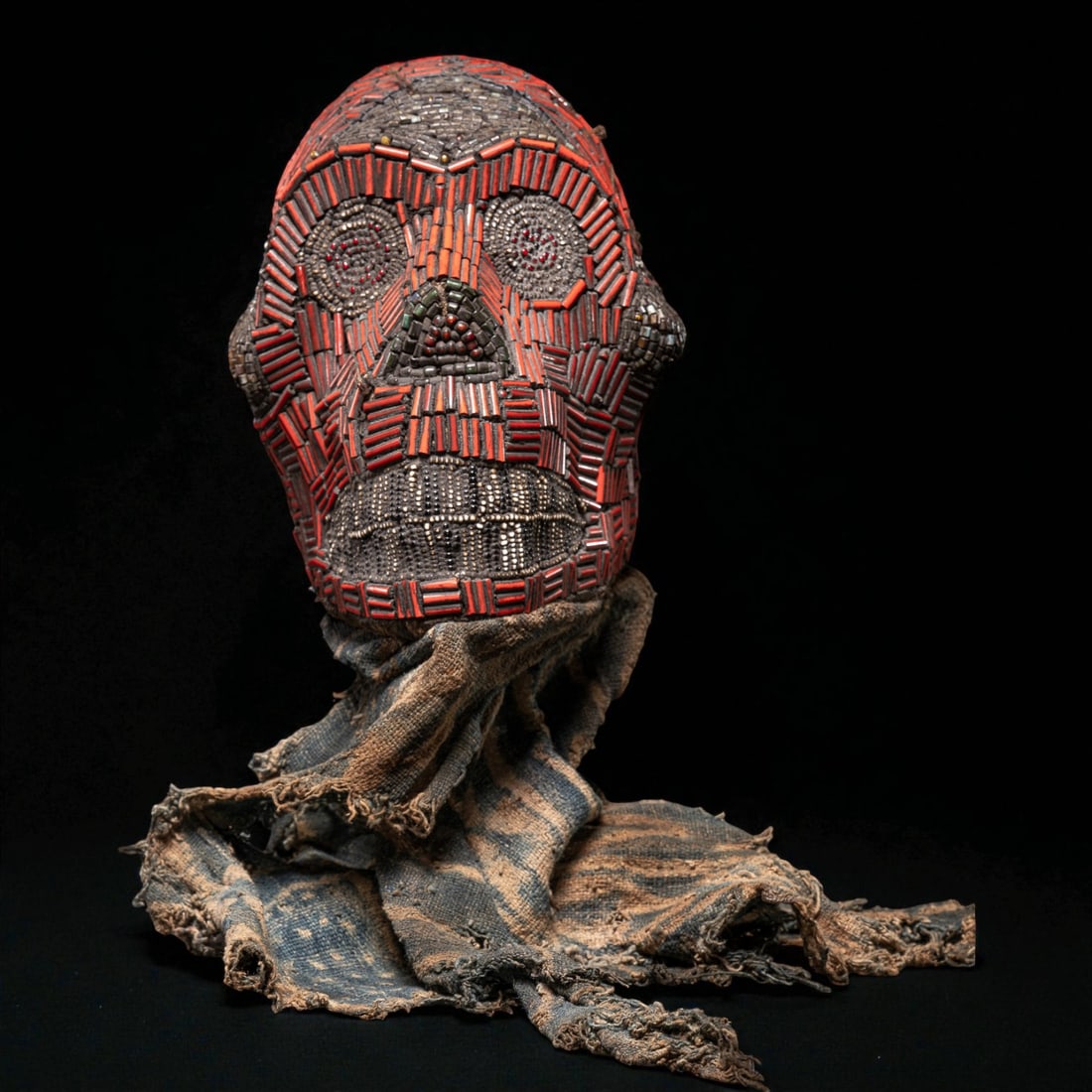 Ceremonial monkey skull, Grasslands, Cameroon, 20th century: Skull decorated with glass beads and organic materials. Dimensions: 43 × 23 × 12 cm. Ritual object from the Grasslands region of Cameroon, where animal skulls were used for ceremonial and symbolic p