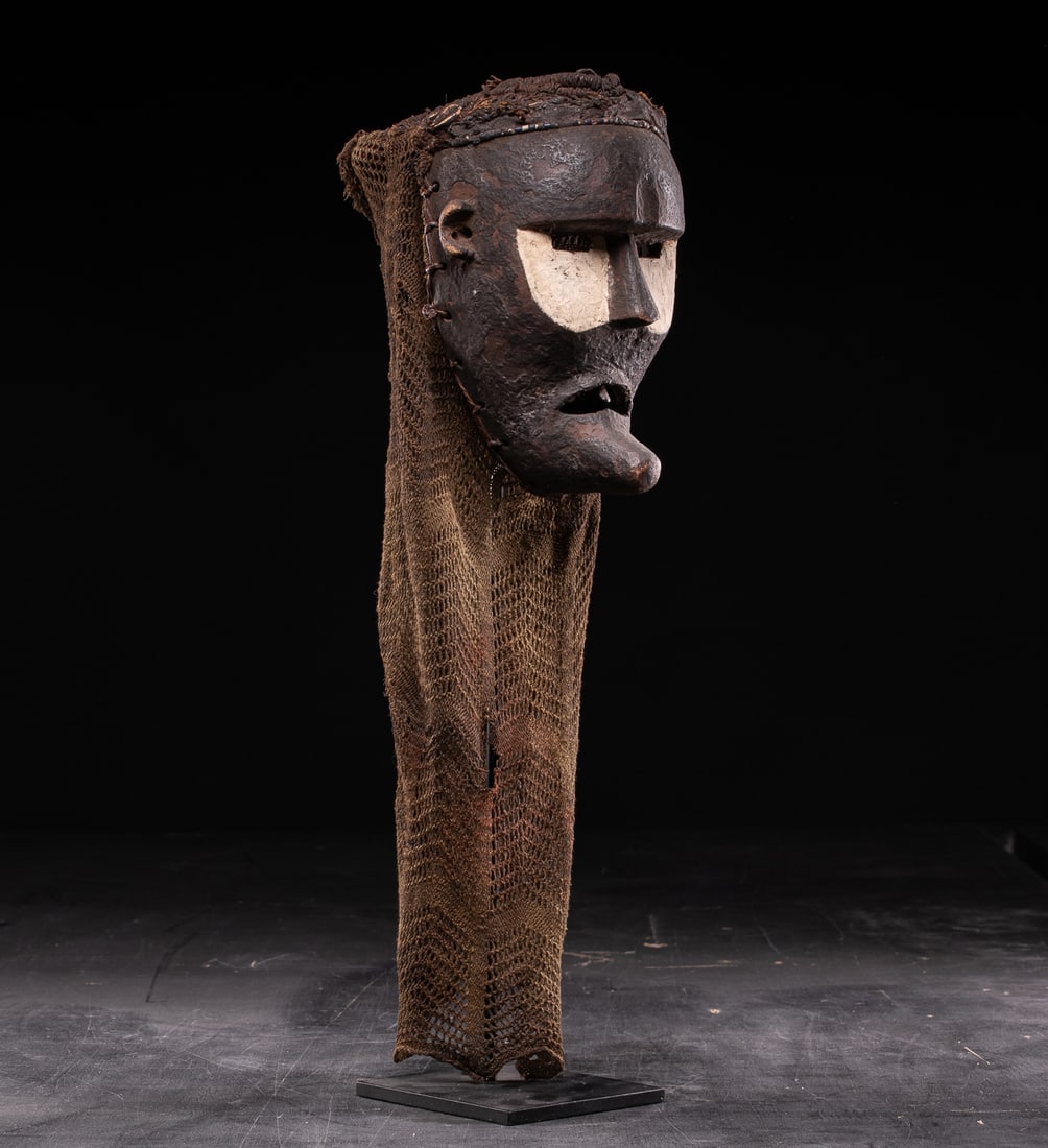 Katoyo mask. Chokwe people, Angola–Democratic Republic of Congo, 19th–20th century: Wood. Dimensions: 58 × 19 × 10 cm. Ritual mask attributed to the Katoyo type, representing non-Chokwe figures, reflecting features associated with Europeans or foreigners, such as an elongated face,