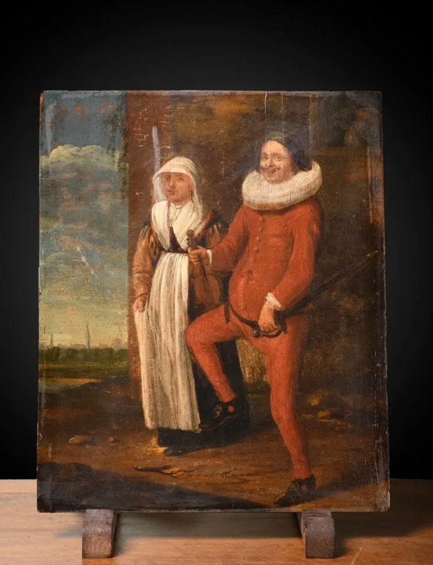 17th Century Flemish School - Peasant Couple: Oil on panel. Dimensions: 22.7 × 34 cm. A 17th-century Flemish genre scene depicting a peasant couple, in which the man is partially dressed as a nobleman, a detail that introduces a satirical touch 