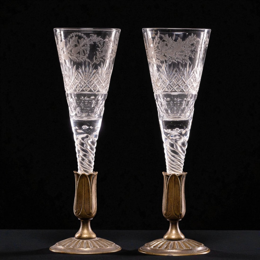 Pair of antique crystal wedding glasses, 19th century: Cut crystal and gilt bronze. Dimensions: 35 × 10 cm. Elegant pair of ceremonial goblets crafted from fine crystal with delicate molded and ornamented bronze stems. These goblets, likely intended for 