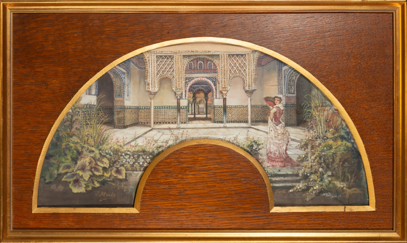 Andalusian genre scene on a fan. Signed. Spanish School. 19th century.: Watercolor on fan-shaped cardboard, framed in wood with a gilt molding. Measurements: 54 × 24 and 64 × 38 cm. The composition depicts an Andalusian courtyard with two female figures in traditional d