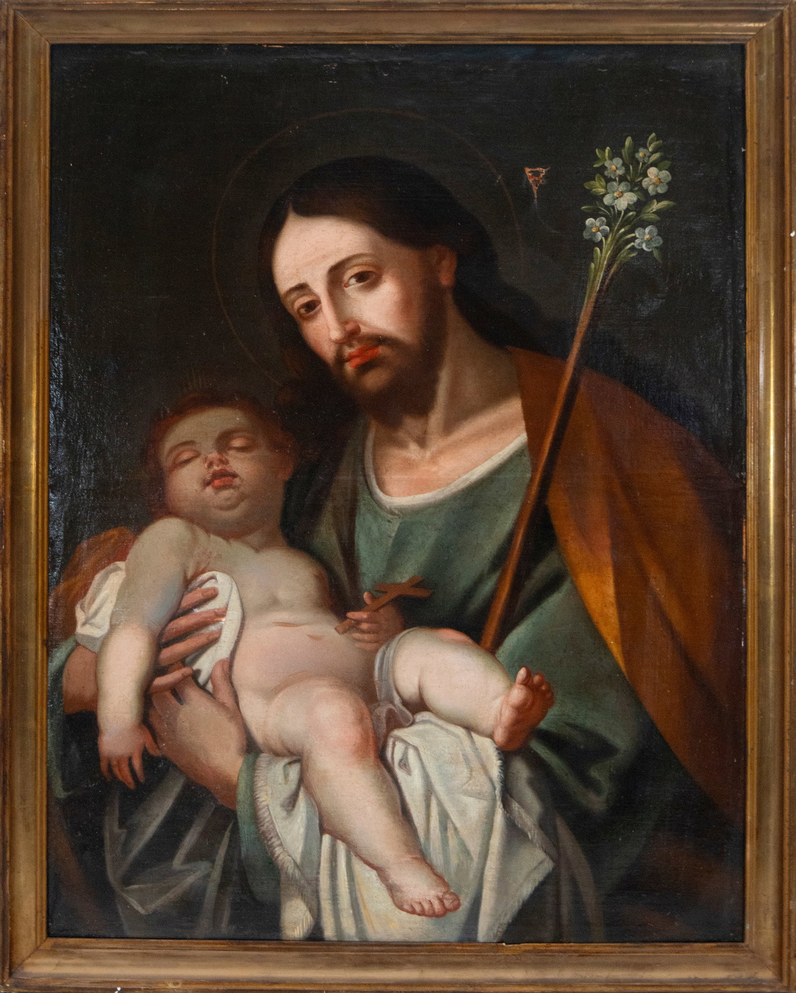 Saint Joseph with the Child. Viceregal school of New Spain. 18th century.: Oil on canvas. Dimensions: 88 x 65 cm and 96 x 73 cm. The work depicts a devotional composition centered on the figure of Saint Joseph, who tenderly cradles the sleeping Christ Child in his arms. The 