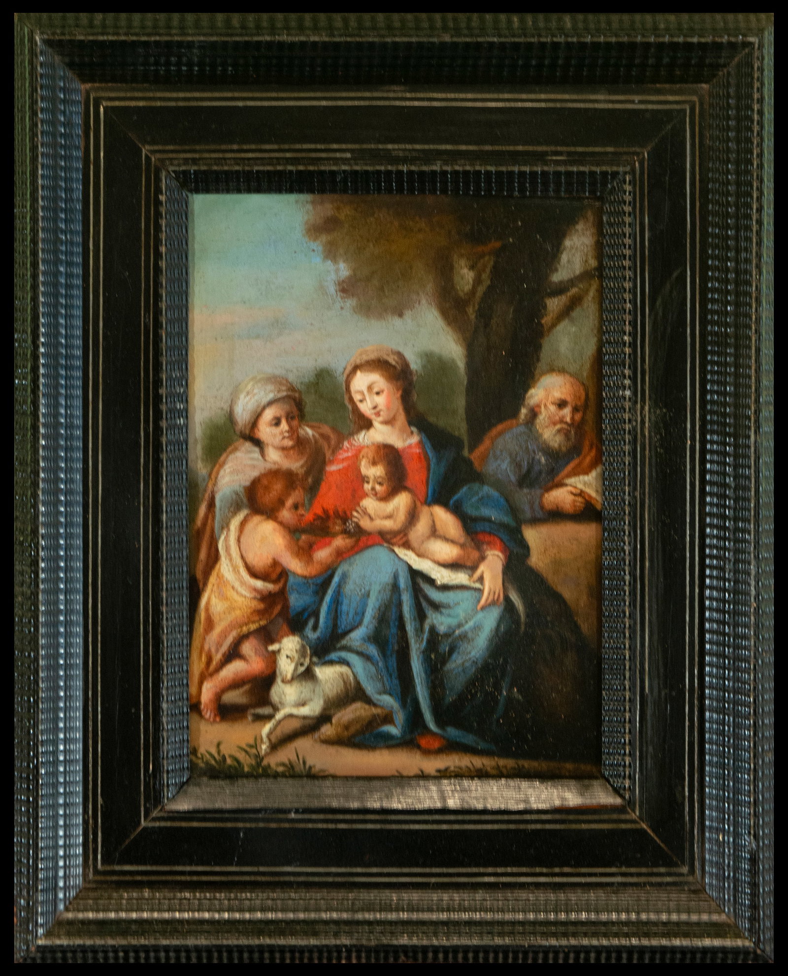 Holy Family with Saint John, Spanish School, 18th Century: A charming scene of the Holy Family accompanied by the young Saint John the Baptist, depicted in oil on canvas. The work stands out for its vibrant use of color and the detailed representation of the 