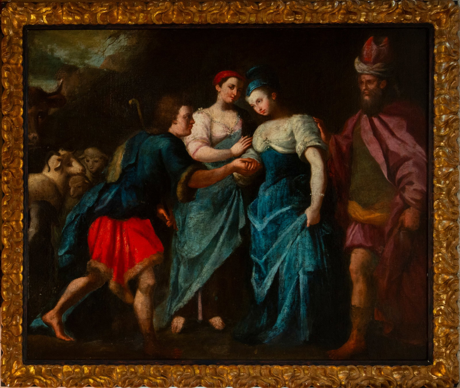 Biblical scene. Italian School. 17th century: Oil on canvas. The work depicts the biblical scene of the encounter between Jacob and Rachel, set in a pastoral landscape with distinct livestock and shepherds. In the foreground, the kneeling male fi