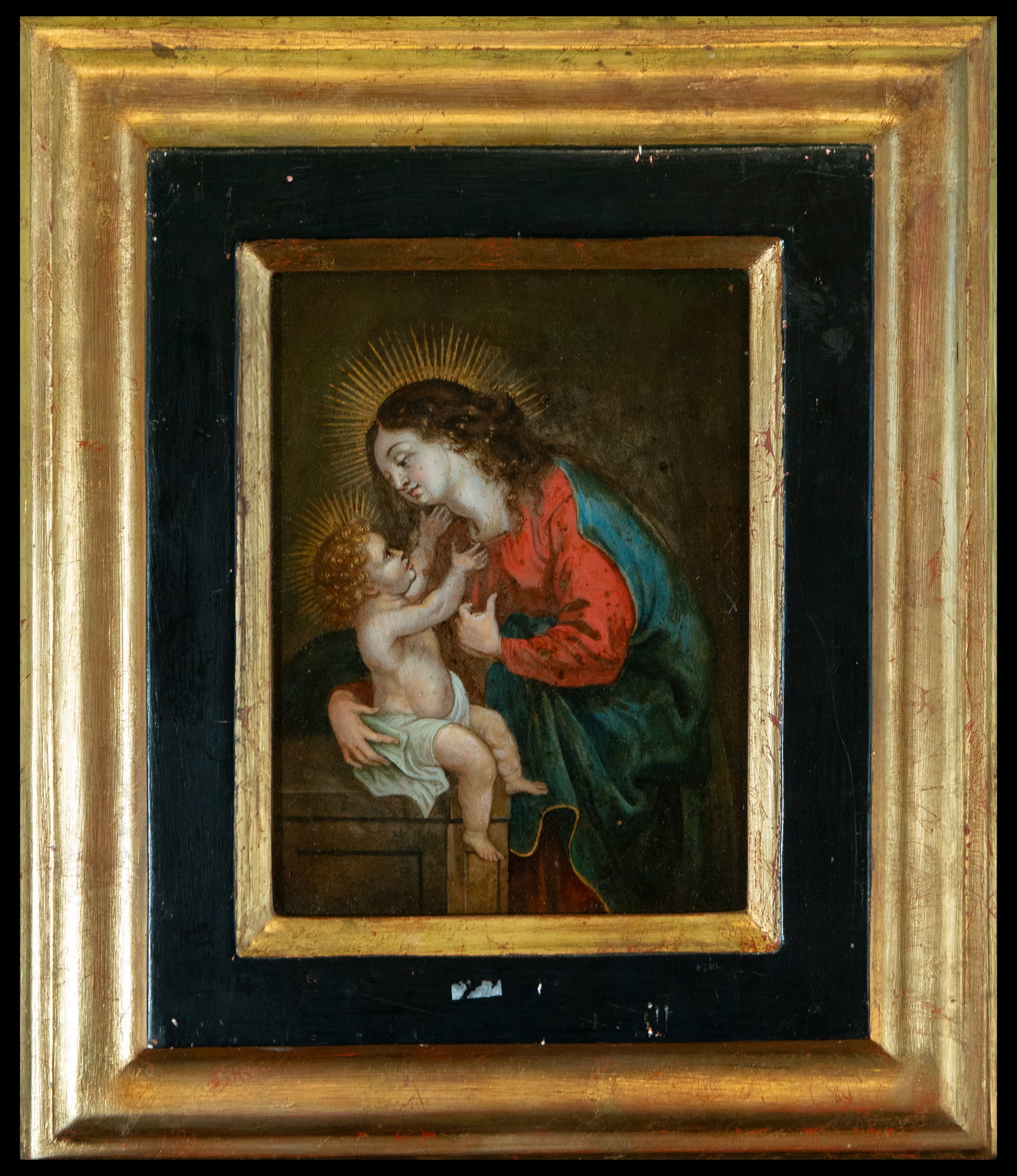 Madonna and Child, Italian School, 17th Century: moving depiction of the Madonna and Child, painted in oil on wood, from the 17th-century Italian School. The Virgin Mary, with a tender expression, holds the Child Jesus, who extends his arms toward h