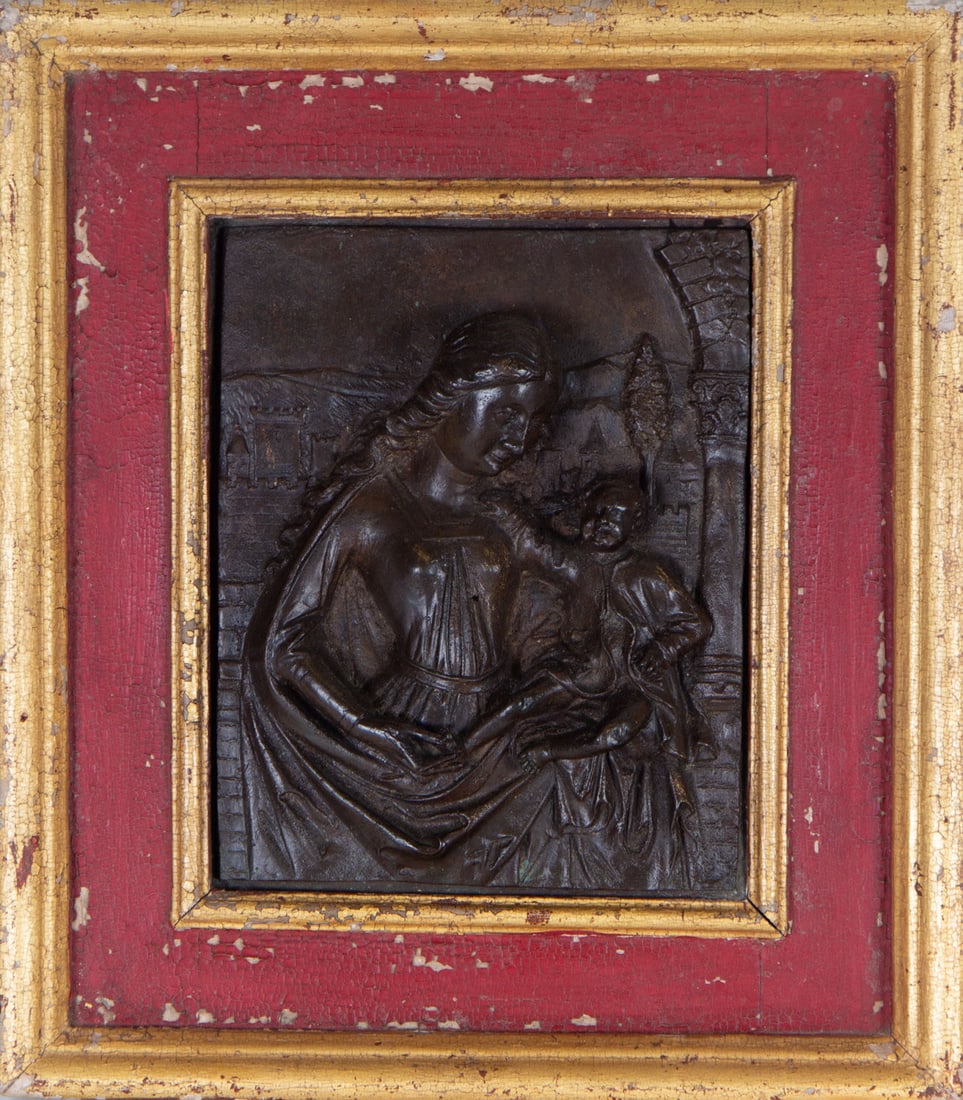 Bronze relief of Virgin with Child in her arms, following Flemish models of the 16th century: In patinated bronze, plate measures: 25 x 19, framed measures: 37 x 33 cm.