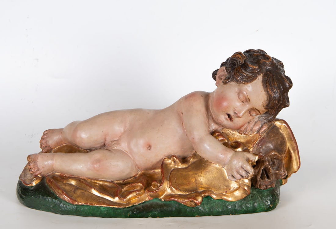 Sleeping Child Jesus, Giovanni Battista Morelli (Rome, ? – Madrid, 1669), Italian school of the: In polychrome terracotta, Terracotta sculpture by the Italian sculptor Giovanni Battista Morelli depicting a little boy sleeping next to a skull. It is a work belonging to the 'vanitas' genre, which h