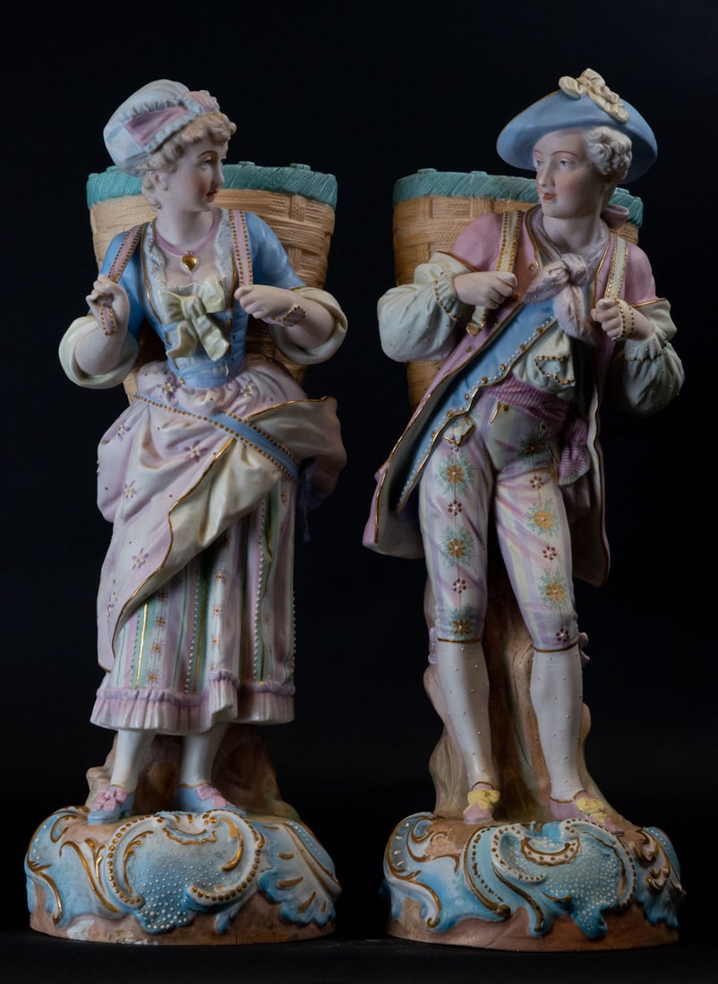 Pair of German Porcelains representing a Peasant couple in polychrome biscuit, 19th century: Measurements: 50 x 17 x 17 cm