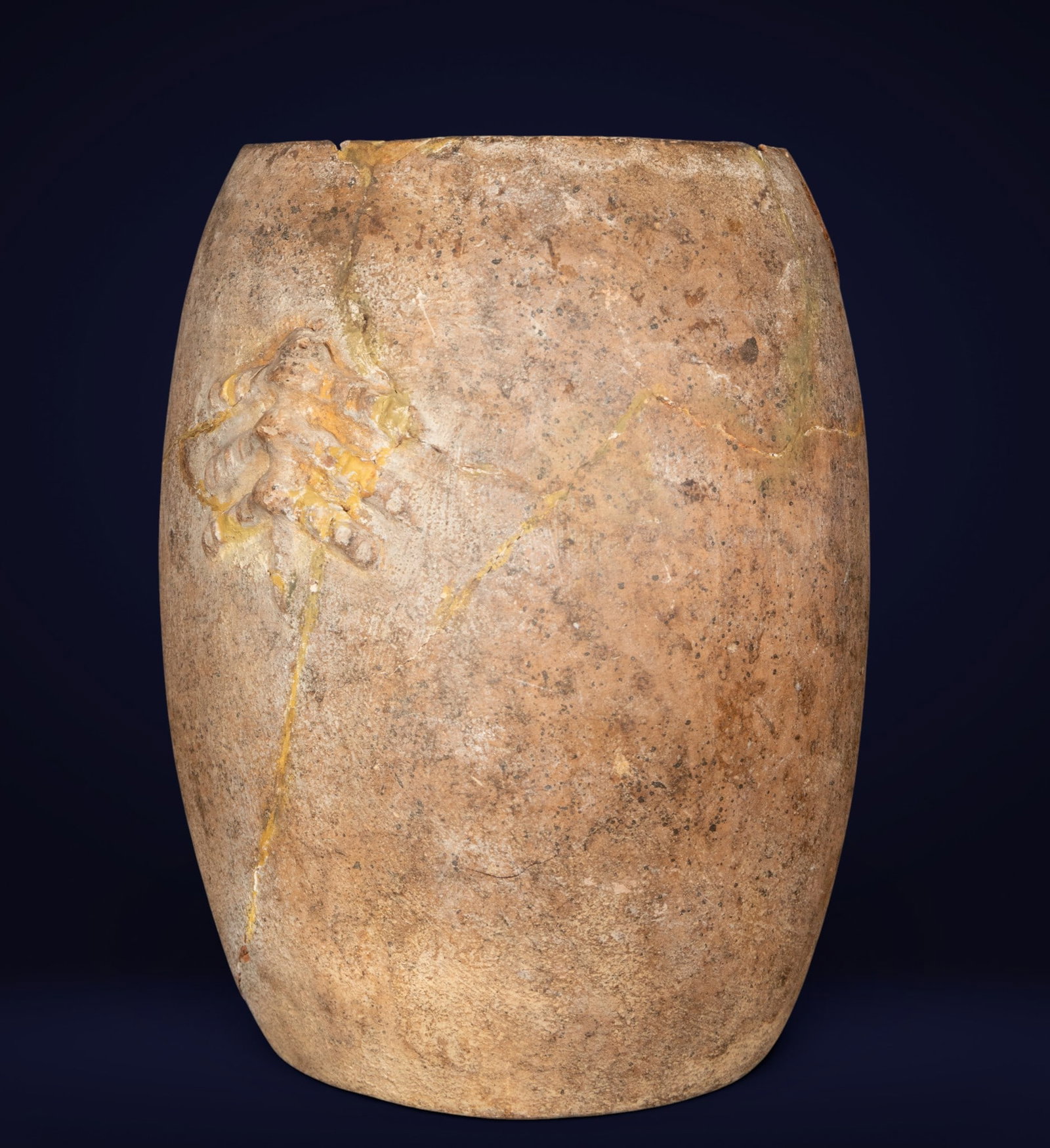 Clay urn from the Magdalena River, Pre-Columbian Culture, 1st Century BC / 5th Century AD: Modeled and fired ceramic. Dimensions: 24 x 17 x 17 cm. Pre-Columbian funerary urn with an ovoid body and a rough-textured surface, decorated with anthropomorphic appliqués of a ritual nature. The pi